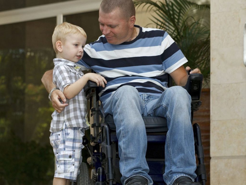 Parent with disability SANA LIVING Man in a wheelchair with child in search of disability accomodation